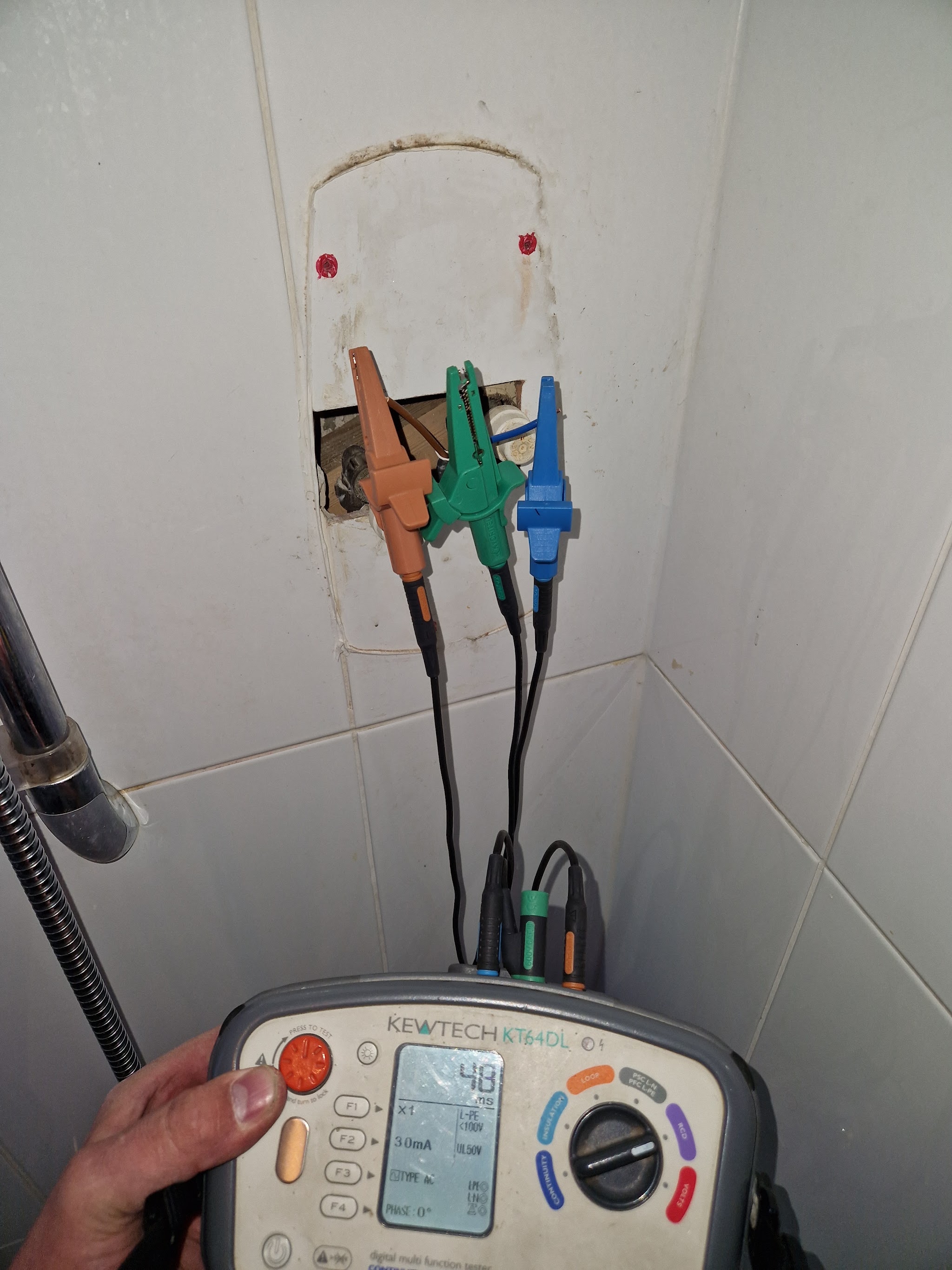 Dan testing a socket with a Kewtech multifunction tester